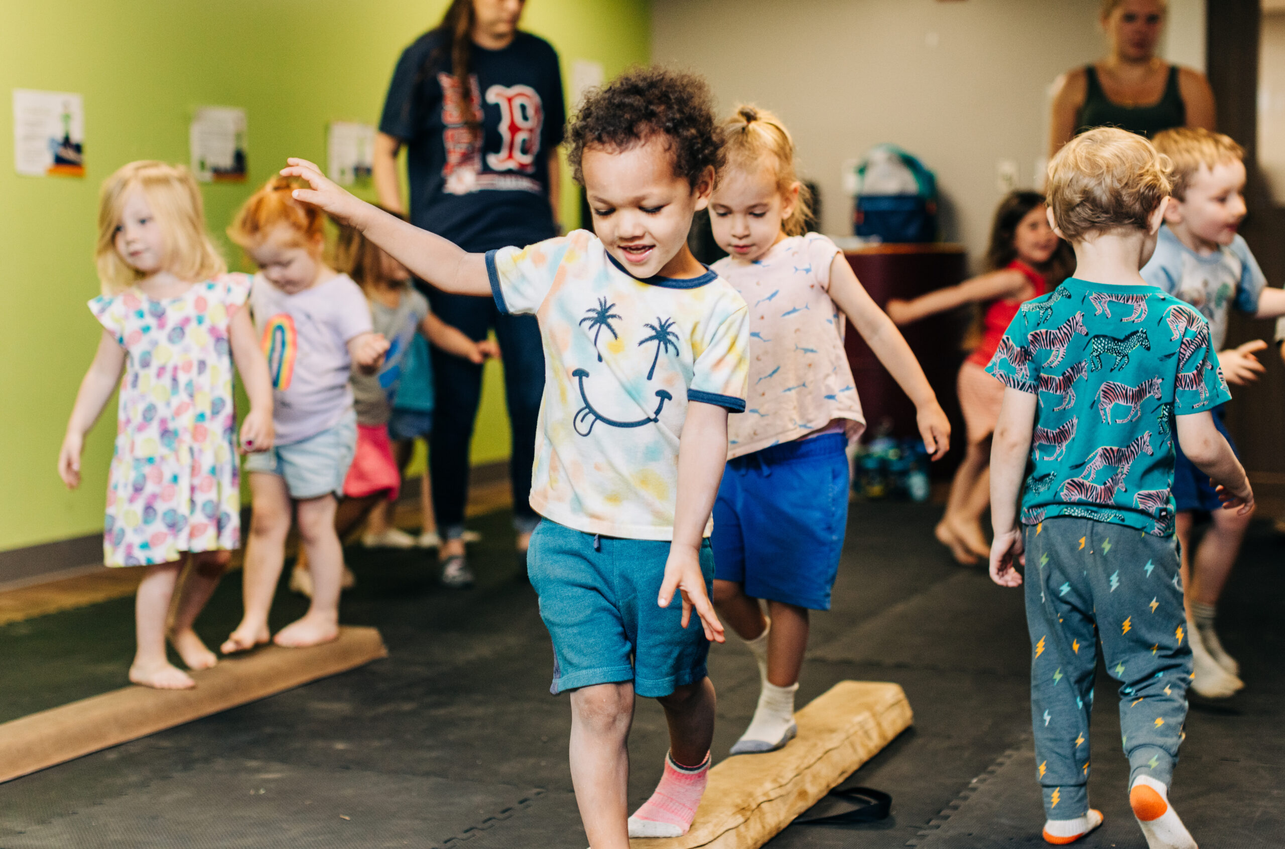 Child Development Center children balancing on a beam